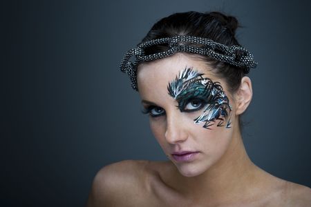 Girl with beautiful artistic face painting - make up の写真素材