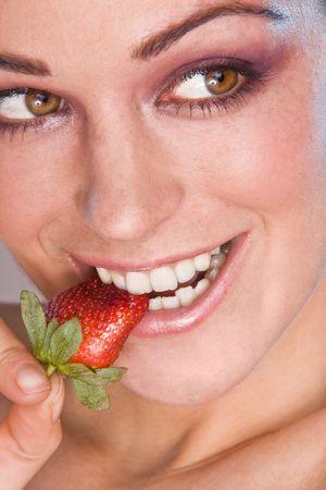 Image of beautiful girl holding strawberryの写真素材