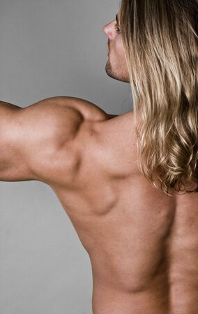 Male Body Builder back with long hair の写真素材