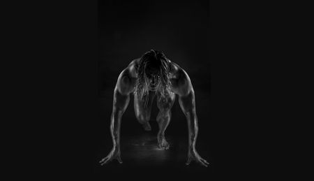  Dramatic image of a beautifully sculpted bodybuilder