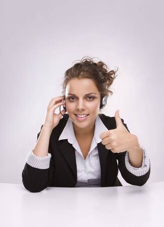  Pretty young business woman having a sucesfull conversation over the mobileの写真素材