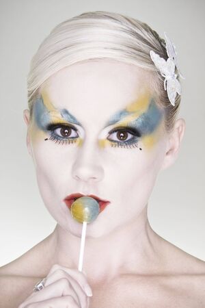 losep portrait of beautiful woman's look with colorfull make-up and lolipop の写真素材