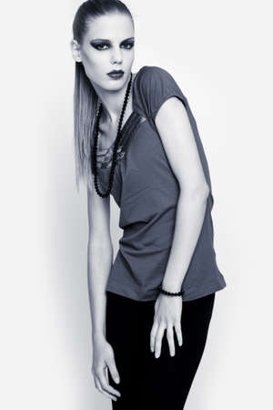 Beautiful fashion model posing isolated over a white backgroundの写真素材