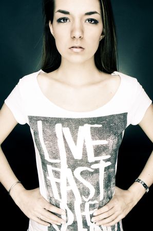 Young sad woman in casual clothing staring at camera.の写真素材