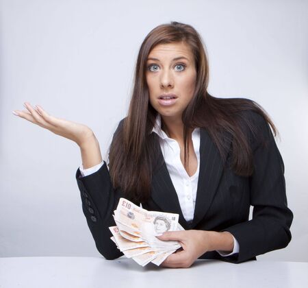 Businesswoman Holding Money british pounds の写真素材