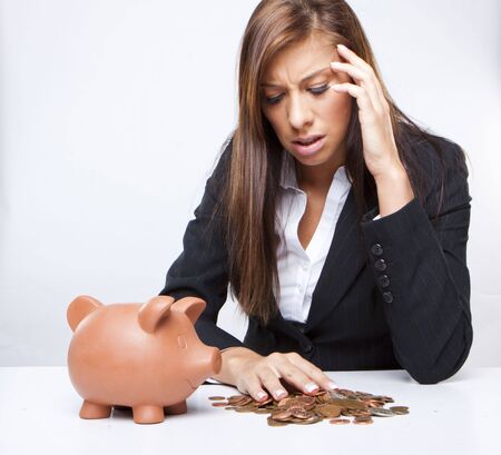 scared  businesswoman counting her savings の写真素材
