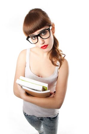teenage student girl holding some books の写真素材