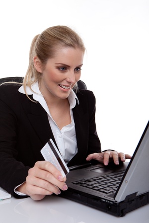 Businesswoman smiling holding credit card の写真素材