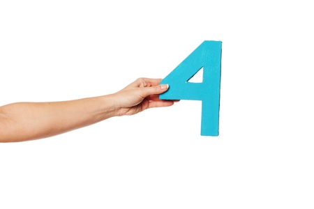 Female hand holding up the number 4 against a white background conceptual of numbers, measurement, amount, quantity, accounting and mathematicsの写真素材