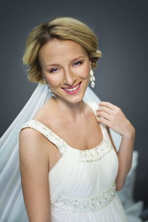 Portrait of beautiful young bride smiling to camera の写真素材