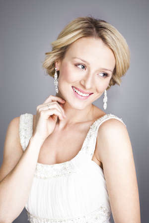 Portrait of beautiful woman smiling to side of camera の写真素材