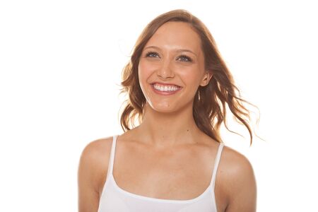 Attractive woman smiling on white backgroundの写真素材