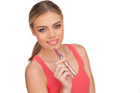 Young Woman Smoking E-cigarette on white backgroundの写真素材