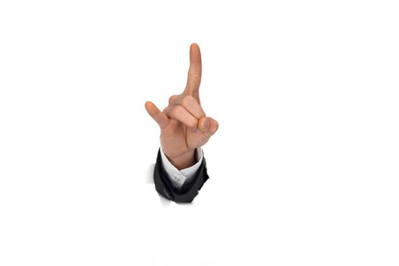 businessman hand breaking through white paper wallの写真素材