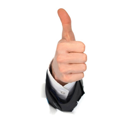 businessman hand OK in the white paper holeの写真素材