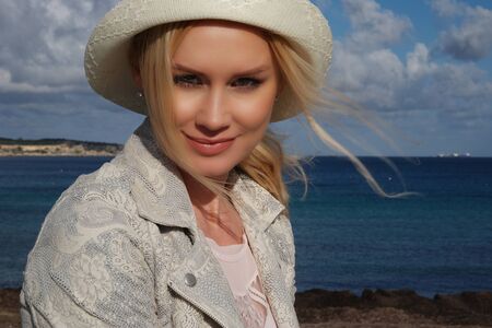 Close up Portrait of Pretty Young Woman Posing at the Beach on a Tropical Climate.の写真素材