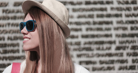 Close up Stylish Young Pretty Woman Wearing Hat and Sunglasses, Looking to the Left of the Frame...