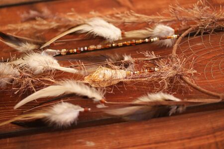 native american bad dream catcher on woodの写真素材