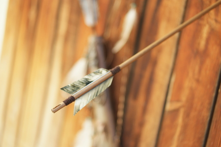 tribal native american feather and bow backgroundの写真素材