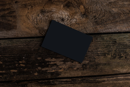 black business card on woodの写真素材