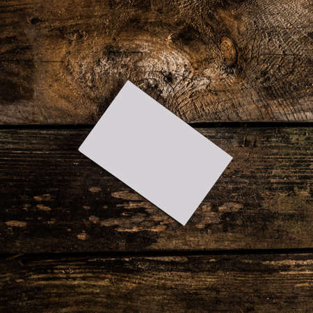 white empty business card on woodの写真素材