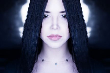 conceptual portrait of a brunette girl with long straight hair