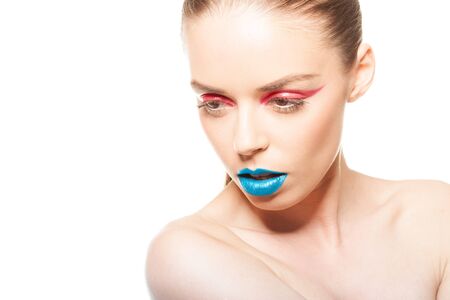 High fashion look.glamor closeup beauty portrait of beautiful sensual Caucasian young woman model with blue lips and red eye linerの写真素材