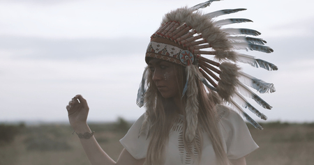 Beautiful indian american ethnic lady with roach on her head.