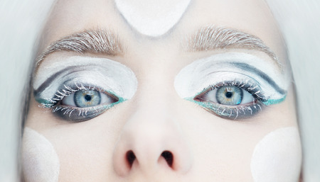 frozen eyes makeup look with white hair and blue eyeの写真素材