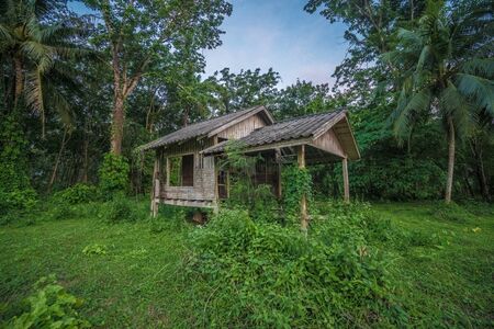 Scenics view of old wooden abandoned cottage against skyの写真素材