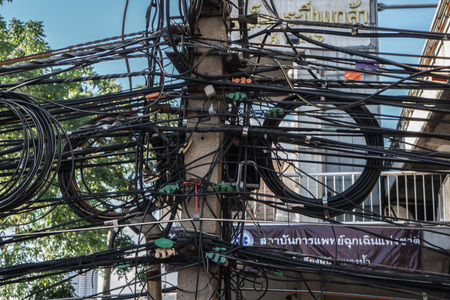 Tangled and messy electrical cables in Bangkok city, Thailandのeditorial素材