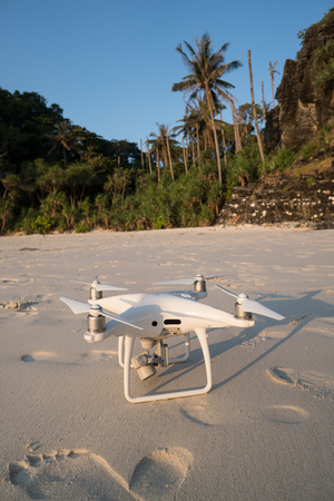 Closeup drone on sandy beach over beautiful summer blue sky and tropical island background