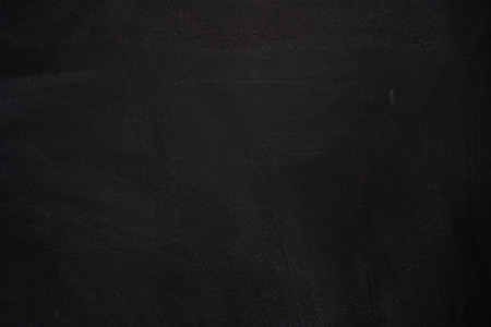 Blackboard/chalkboard texture. Empty blank black chalkboard with chalk tracesの写真素材