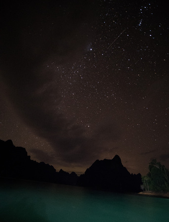 Stars and night sky over lake background