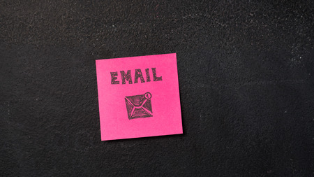 Sticky note with Email word on the blackboardの写真素材