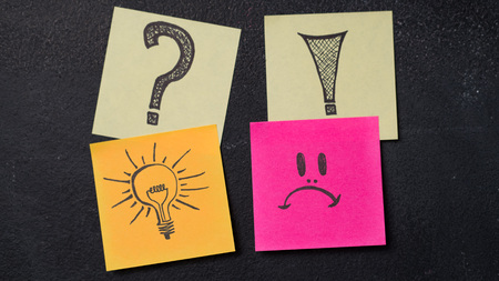 Sticky notes with question, exclamation marks, light bulb idea symbol and unhappy face icon drawning...
