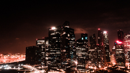 Aerial drone view of Singapore skyscrapers with city skyline at nightのeditorial素材
