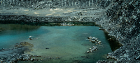 Copper or other rock mining area with ponds in Asia