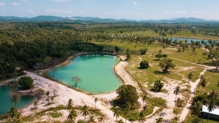 Aerial drone view of beautiful lagoon ponds on tropical island during sunny summer dayの写真素材
