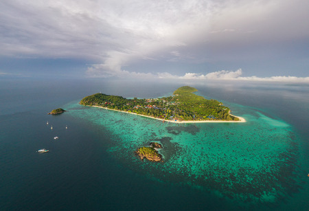Aerial drone view of beautiful tropical Koh Lipe island during sunny summer day, Thailandの写真素材