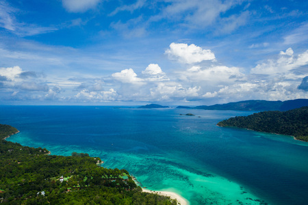 Aerial drone view of beautiful green Koh Usen island with amazing lagoon sea over summer sky background, Thailandの写真素材