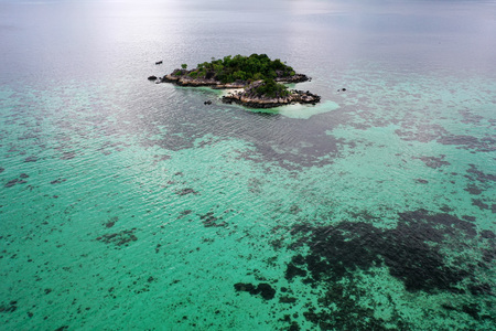 Aerial drone view of amazing tropical paradise Koh Kra island with white empty beach during sunny...