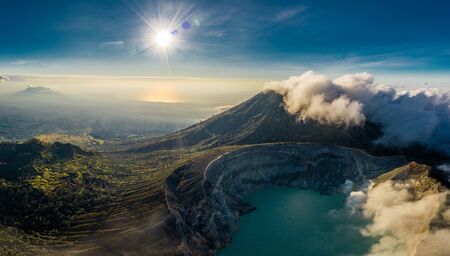 Aerial view of beautiful Ijen volcano with acid lake and sulfur gas going from crater, Indonesiaの写真素材