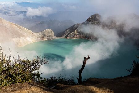 Aerial view of beautiful Ijen volcano with acid lake and sulfur gas going from crater, Indonesiaの写真素材