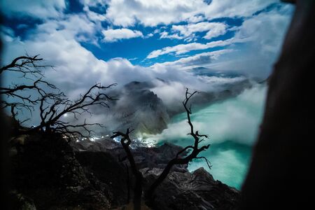 Aerial view of beautiful Ijen volcano with acid lake and sulfur gas going from crater, Indonesiaの写真素材