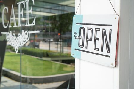 OPEN sign hang on street cafe door at entranceの写真素材