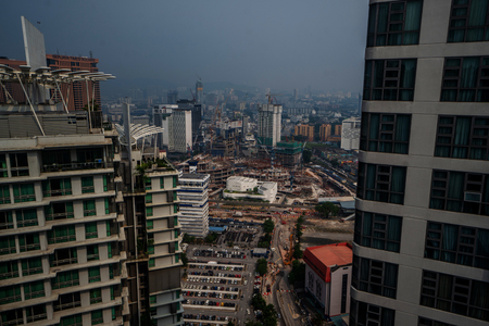 Aerial view of Kuala Lumpur city skyline during cloudy day, Malaysiaのeditorial素材