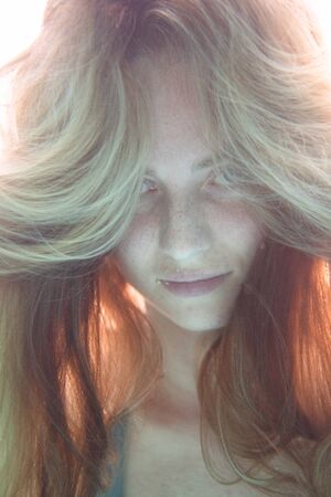 Closeup face of beautiful woman swimming underwaterの写真素材
