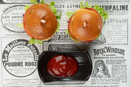Two mini beef burgers with beetroot relish. Beef patties on two brioche buns with lettuce and beetrootの写真素材