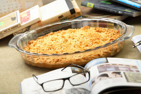 Casserole in oven-proof dish between booksの写真素材